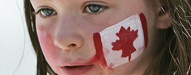 Child with Canadian flag on cheek (Canadian Press)