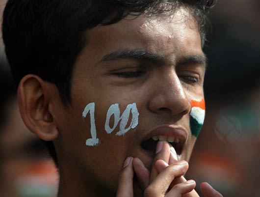 A young fan is dejected after Sachin Tendulkar was dismissed six runs short of his 100th hundred in international cricket in the Mumbai Test. 