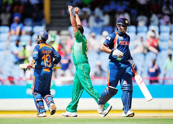 Photo number 3 in the cricket slideshow Match 5: India vs South Africa. Photo caption, "  Jacques Kallis (C) celebrates after taking the wicket of Dinesh Karthik (L) during the ICC World Twenty20 match between South Africa and India played at The Beausejour Cricket Ground in Gros Islet. (Emmanuel Dunand/AFP/Getty Images) "