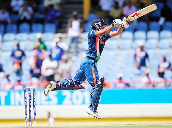 Photo number 6 in the cricket slideshow Match 5: India vs South Africa. Photo caption, "  Suresh Raina jumps full stretch for a boundary during the ICC World Twenty20 match between South Africa and India played at The Beausejour Cricket Ground in Gros Islet. (Emmanuel Dunand/AFP/Getty Images) "