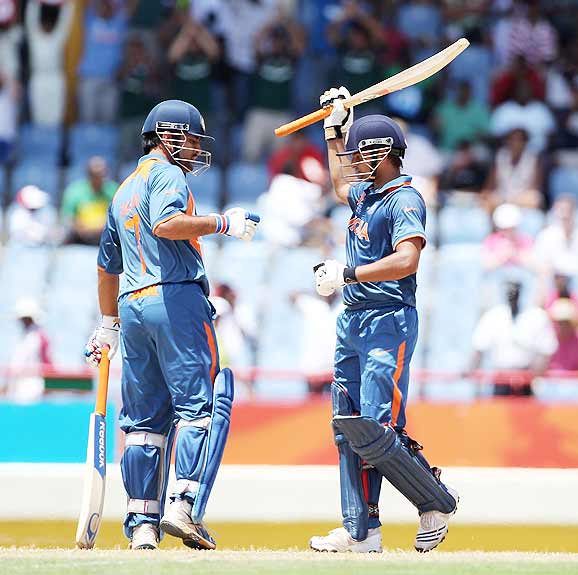 Photo number 4 in the cricket slideshow Match 5: India vs South Africa. Photo caption, "  MS Dhoni congratulates Suresh Raina on reaching his century during the ICC World Twenty20 match between South Africa and India played at The Beausejour Cricket Ground in Gros Islet. (Getty Images) "