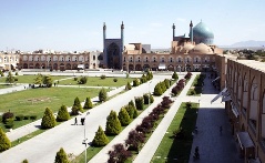 Naqsh-e Jahan Square in Isfahan, Iran, is bounded by four monumental structures: the mosaic-tiled Royal Mosque to the south, the Portico of Qaysariyyeh to the north, the Mosque of Sheykh Lotfollah to the east, and the magnificent entrance to Ali Qapu palace and the royal gardens to the west.