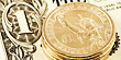 One dollar coin on note (Thinkstock)