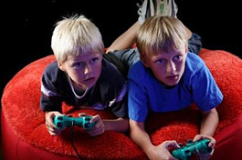 Kids playing video games (iStockPhoto)
