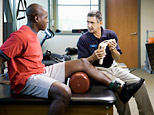 A physical therapist working with a patient (Getty Images)