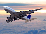 An airliner in the clouds (iStockPhoto)