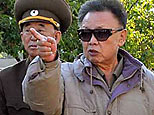 In this undated photo released by Korean Central News Agency via Korea News Service in Tokyo Sunday, June 14, 2009, North Korean leader Kim Jong Il, center, inspects the command of the 7th Infantry Division of the Korean People's Army at an undisclosed location in North Korea. (AP Photo/Korean Central News Agency via Korea News Service)