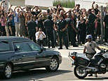  A hearse carrying the body of Michael Jackson arrives at Staples Center for a memorial service for the pop star Tuesday, July 7, 2009, in Los Angeles. (AP Photo/Marcio Sanchez)