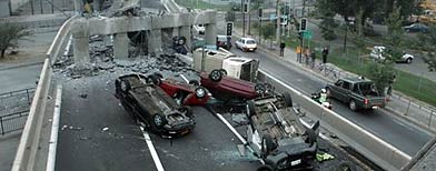 Vehicles that were driving along a highway that collapsed during the earthquake near Santiago, Chile (AP Photo/David Lillo)