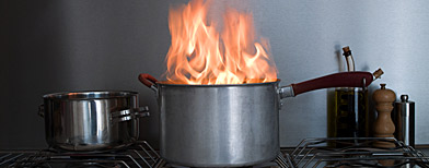 Saucepan on fire (Image Source/Corbis)