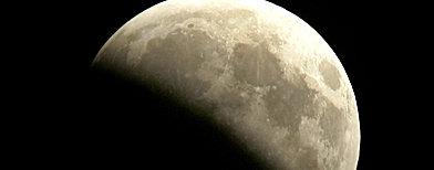 A partial lunar eclipse is seen in Frankfurt, central Germany, Saturday evening, Aug. 16, 2008. (AP Photo/Michael Probst)