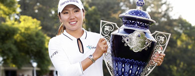 In-Kyung Kim of South Korea of South Korea holds the trophy after  winning the Lorena Ochoa Invitational. (Michael Cohen/Getty Images)