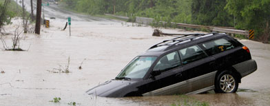 A stranded car sits on a flooded road on Saturday, May 1, 2010 in Franklin, Tenn. (AP Photo/Mark Humphrey)