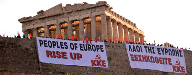 Greek protesters unfurl banners over the defensive walls of the ancient Acropolis, the country's most famous monument, to protest harsh new austerity measures as strikes began on Tuesday May 4, 2010 across the country. (AP Photo/Nikolas Giakoumidis)