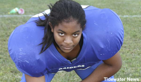 Girl football player sits out game after foe threatens forfeit