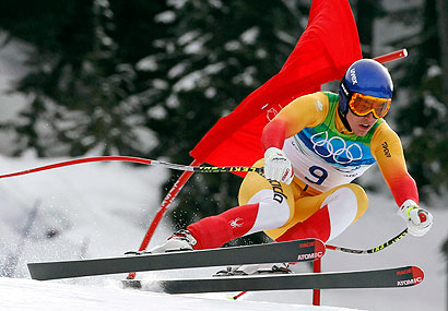 Canada's Erik Guay speeds down the course during the Men's Downhill, at the Vancouver 2010 Olympics in Whistler, British Columbia, Monday, Feb. 15, 2010 . (AP Photo/Alessandro Trovati)