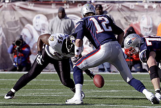 Suggs causes Brady to fumble in Baltimore's playoff victory.
