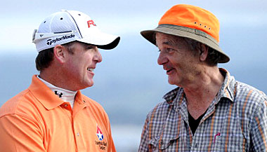 D.A Points is congratulated by his playing partner Bill Murray.