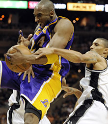 Kobe Bryant, left, is fouled by George Hill.