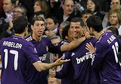 Real Madrid teammates celebrate Cristiano Ronaldo's goal.