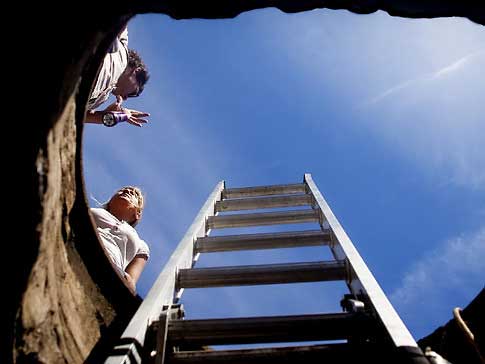  accessible by descending down a ladder through a manhole on the border 