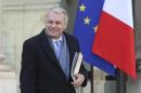 French Prime Minister Ayrault leaves the weekly cabinet meeting at the Elysee Palace in Paris