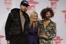 DJ Afrojack, presenter Laura Whitmore and musician Redfoo pose for photographers at the press conference for the European MTV Awards 2013 in Amsterdam, Saturday, Nov. 9, 2013. (AP Photo/Peter Dejong)