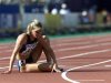 Suzy Favor-Hamilton of the U.S. sits on the track after a DNF in her heat of the 1500 meter semifina..