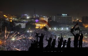 Egyptians wave national flags as fireworks light the …