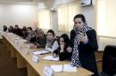 Afghan woman speaks as they attend a class of the gender and women's studies masters program in Kabul University, Afghanistan
