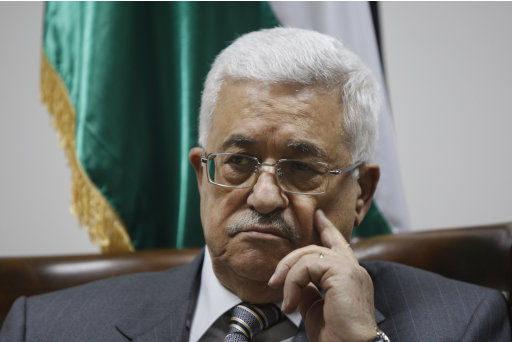 Palestinian President Mahmoud Abbas pauses during a meeting with Palestinian doctors at his office in the West Bank city of Ramallah, Tuesday, Sept. 6, 2011. A delegation of 40 Palestinian medics met with Abbas on Tuesday before leaving on an aid mission to Libya. (AP Photo/Majdi Mohammed)