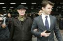 Australian missionary John Short, left, walks out from the airport terminal as he arrives at Beijing International Airport in Beijing, China, Monday, March 3, 2014. Short was deported from North Korea after he was detained for spreading Christianity in the country and apologized for his anti-state religious acts and requested forgiveness. (AP Photo/Vincent Thian)