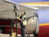 FILE - In this April 23, 2008 file photo, an aviation ground crew member pumps fuel into a Southwest Airlines' plane at Los Angeles International Airport in Los Angeles. Why is it so hard to make money in the airline business? Airlines buy multi-million-dollar jets and then don’t just have to factor in the flow of business travelers but the whims of vacationers, the price of fuel and the weather. (AP Photo/Ric Francis, File)