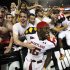 Maryland defensive back Anthony Green, center, celebrates with fans after Maryland's 32-24 win over Miami in an NCAA college football game in College Park, Md., Monday, Sept. 5, 2011. (AP Photo/Patrick Semansky)