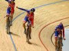 Britain's Joanna Rowsell, left, Danielle King, center, and Laura Trott celebrate winning the women's team pursuit at the Track Cycling World Championships in Melbourne, Australia, Thursday, April 5, 2012. Britain won the final over Australia in the world record time of 3:15.720. (AP Photo/Rick Rycroft)