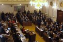 Deputies applaud after the Czech parliament dissolved itself in Prague