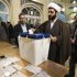 A cleric casts his ballot during the parliamentary election in southern Tehran