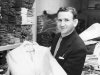 In this 1957 photo provided courtesy of the Bernard J. Lansky Collection, clothier Bernard Lansky displays a jacket in his high-fashion store in Memphis, Tenn. Lansky, known as the clothier to rock and roll icon Elvis Presley, died Thursday, Nov. 15, 2012 at age 85 in Memphis. (AP Photo/Courtesy of the Bernard J. Lansky Collection) MANDATORY CREDIT