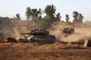Israeli soldiers manoeuvre tanks during a military exercise in the northern part of the Israeli-annexed Golan Heights near the border with Syria on June 23, 2016