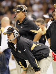 FILE - In this Sept. 26, 2010, file photo, New Orleans Saints head coach Sean Payton, foreground, and defensive coordinator Gregg Williams, background, look on during an NFL football game at the Louisiana Superdome in New Orleans, La. The NFL has suspended Payton for the 2012 season, and former Saints defensive coordinator Gregg Williams is banned from the league indefinitely because of the team's bounty program that targeted opposing players. Also Wednesday, March 21, 2012, Goodell suspended Saints general manager Mickey Loomis for the first eight regular-season games of 2012, and assistant coach Joe Vitt has to sit out the first six games. (AP Photo/Patrick Semansky, File)
