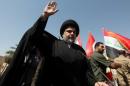 Iraqi Shi'ite cleric Moqtada al-Sadr is seen during a protest against corruption at Tahrir Square in Baghdad
