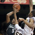 Minnesota's Ralph Sampson III (50) blocks the shot of Michigan State's Adreian Payne (5) as Minnesota's Rodney Williams, right, moves in on the play during the first half of an NCAA college basketball game, Wednesday, Feb. 22, 2012, in Minneapolis. (AP Photo/Tom Olmscheid)