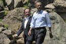 France's President Hollande and U.S. President Obama walk to the family photo session at the G8 summit at Camp David, Maryland