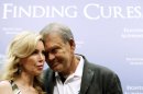 Country singer Glen Campbell, who has Alzheimer's disease, stands with his wife Kim during a news conference on Capitol Hill in Washington, Tuesday, May 15, 2012.(AP Photo/Charles Dharapak)