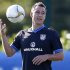 England's John Terry catches the ball during a soccer training session in London Colney