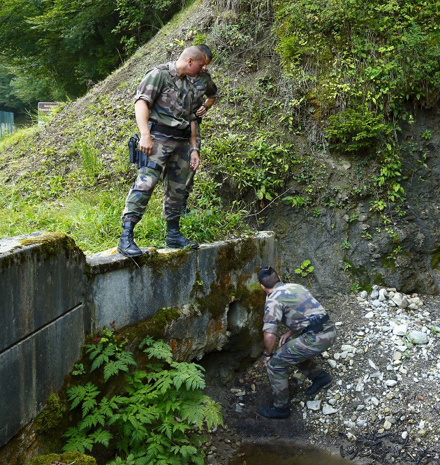 French police inspect a drain …