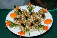 This undated photo provided by the United Nations Food and Agriculture Organization (FAO) shows a plate with insects during an insect cuisine competition at an unknown location in Laos. The U.N. has new weapons to fight hunger, boost nutrition and reduce pollution, and they might be crawling or flying near you right now: edible insects. The Food and Agriculture Organization on Monday, May 13, 2013, hailed the likes of grasshoppers, ants and other members of the insect world as an underutilized food for people, livestock and pets. A 200-page report, released at a news conference at the U.N. agency's Rome headquarters, says 2 billion people worldwide already supplement their diets with insects, which are high in protein and minerals, and have environmental benefits. (AP Photo/Thomas Calame, FAO, ho)