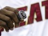 Miami Heat's LeBron James holds his 2012 NBA Finals championship ring during a ceremony before a basketball game against the Boston Celtics, Tuesday, Oct. 30, 2012, in Miami. (AP Photo/J Pat Carter)