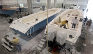 <p>               In this Jan. 11, 2012 boat builders work on SeaHunter hulls at SeaHunter Boats, for delivery in Princeton, Fla. The Commerce Department says factory orders fell 1 percent in January. Investment in a category considered a proxy for business investment fell 3.9 percent, the biggest decline in a year. This followed a big increase in December, the final month businesses could take advantage of a one-year investment tax break. (AP Photo/Alan Diaz)