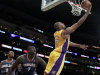Los Angeles Lakers center Andrew Bynum, right, scores past the Charlotte Bobcats center DeSagana Diop during the first half of an NBA basketball game in Los Angeles, Tuesday, Jan. 31, 2012. (AP Photo/Chris Carlson)